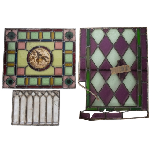 321 - A Victorian stained and leaded glass panel, late 19th century; in Aesthetic taste, the central tondo... 