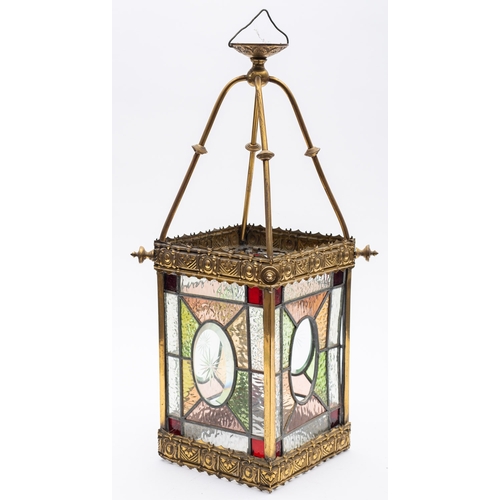 355 - A late Victorian brass and leaded stained glass hall lantern, the square glass panels with oval stel... 