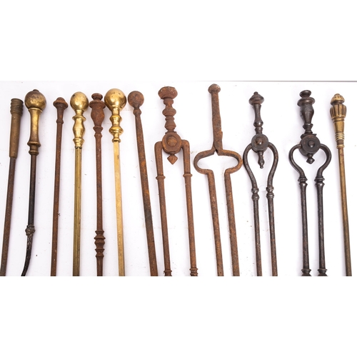 388 - A quantity of wrought iron and brass mounted fire tools, 19th century; including various pokers, ton... 