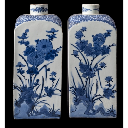 404 - A pair of Japanese Arita blue and white square-section bottles (tokkuri), circa 1700, decorated with... 