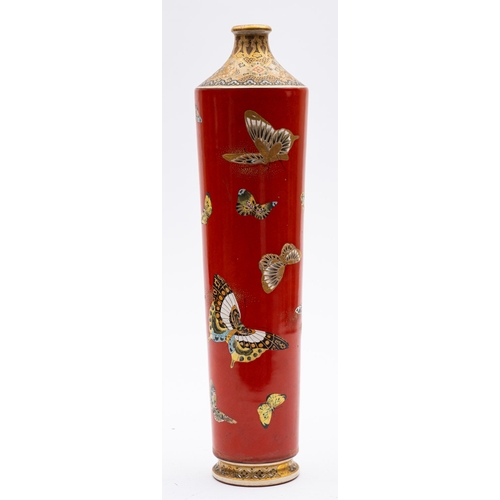 406 - A Satsuma pottery vase of tapering cylindrical form, the iron red body enamelled with butterflies, t... 