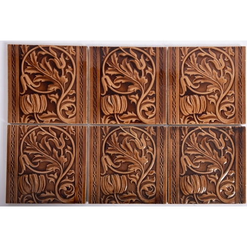 410 - A set of six Minton's brown glazed pottery square tiles, decorated with flower heads and scrolling a... 