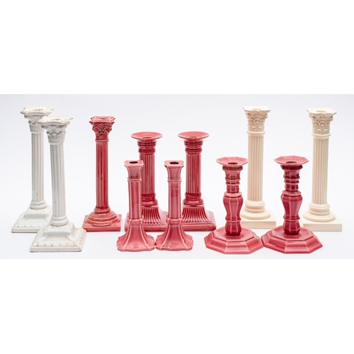 430 - Five pairs of white and pink glazed candlesticks and one single candlestick.