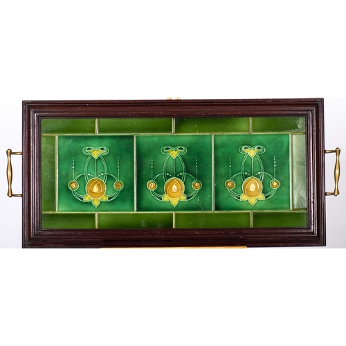 432 - An Edwardian mahogany and brass tray, inset green glazed Art Nouveau patterned tiles together with t... 