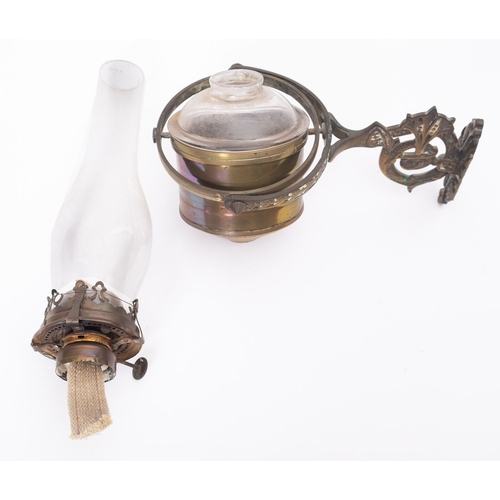 183 - An Edwardian brass cabin oil lamp, the clear glass chimney with brass burner and clear glass reservo... 