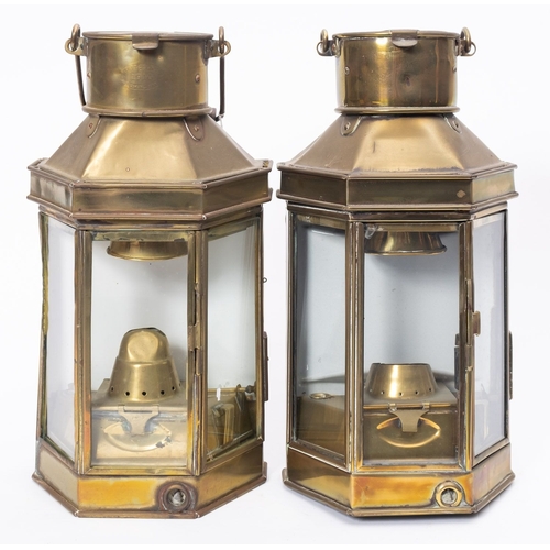 184 - A matched pair of WWI period bulkhead engine room lamps, with glass panels and  original burners wit... 
