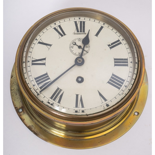 186 - A  WWII period circular brass bulkhead clock, maker  W Elliott Ltd, London,  white enamel dial with ... 