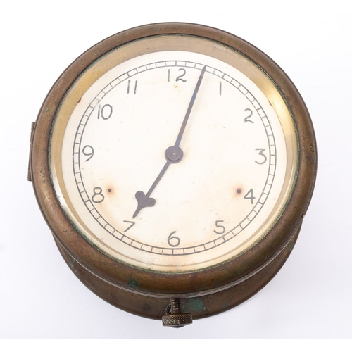 197 - A brass bulkhead clock, unsigned, the 5 1/2 inch dial with Arabic numerals and steel hands, under a ... 