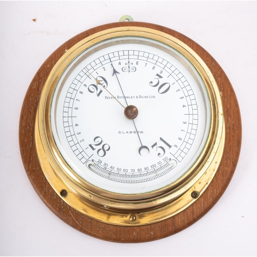 205 - A brass bulkhead barometer, maker Kelvin Bottomley & Baird Ltd, Glasgow, the white enamel dial  sign... 