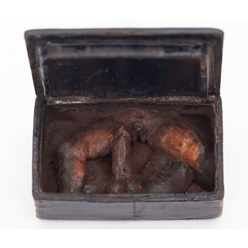 300 - A 19th Century papier mache snuff box containing a carved erotic view, 5cm wide, together with a Roy... 