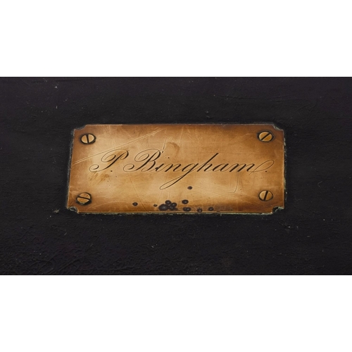 333 - A Regency period brass bound black leather trunk inscribed 'P Bingham',  with studded decoration, br... 