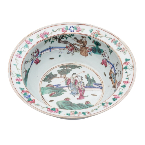 A Chinese famille rose basin with everted rim, the interior painted ...