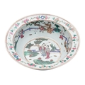 A Chinese famille rose basin with everted rim, the interior painted ...