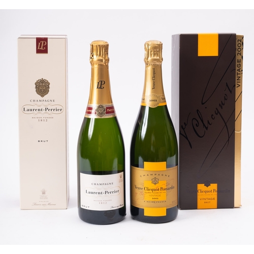 614 - Two bottles of vintage champagne together with two bottles of Moet & Chandon