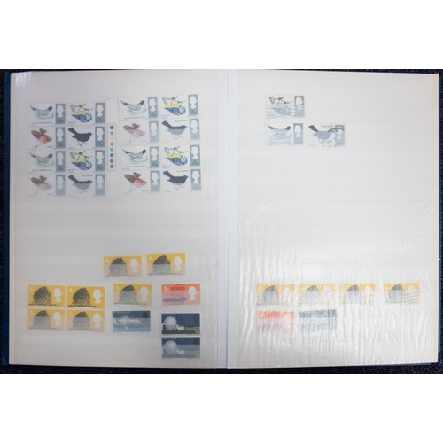 674 - An accumulation of stamps in albums, stock books and loose with mint Great Britain..   .