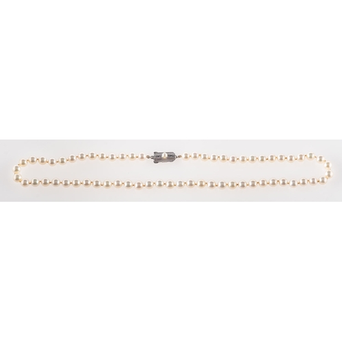 383 - Mikimoto. A pearl necklace, a string of white cultured pearls, approx. 6.5mm to 7mm, to a silver pea... 