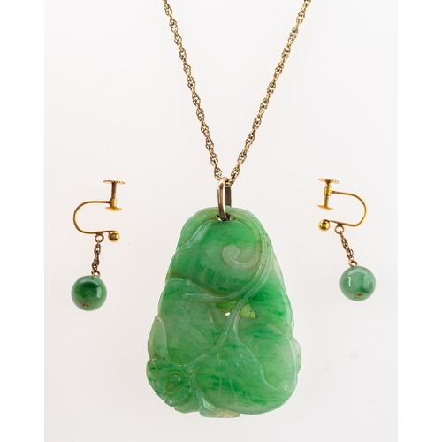 384 - A group of two items of jade jewellery, including a foliate carved jade pendant with loop bale, unma... 