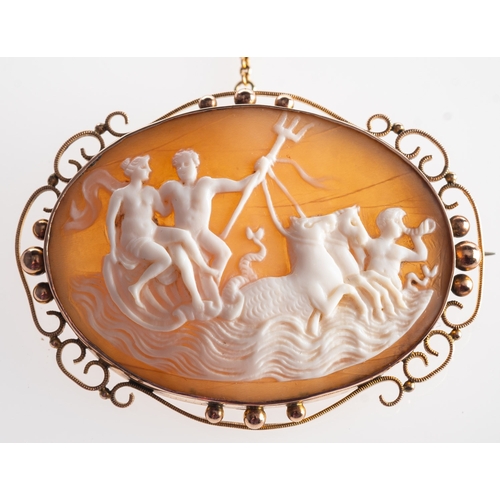 394 - A large oval cameo, in an openwork and bead frame, depicting figures & horses, safety chain, marked ... 