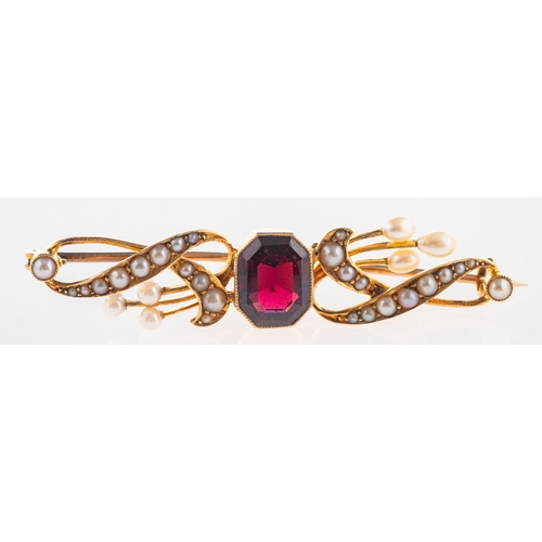 395 - An antique bar brooch, collet set with an octagonal-cut garnet, the openwork ribbon design interspac... 