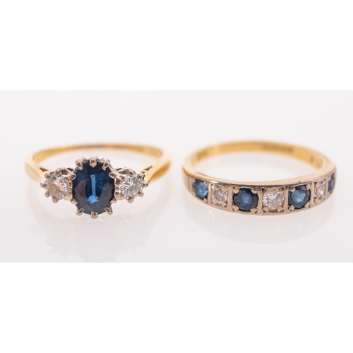 832 - A group of two 18ct gold sapphire and diamond rings, including a three stone ring set centrally with... 