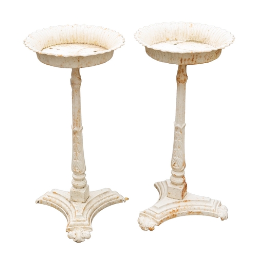 1114 - A pair of Victorian painted cast iron conservatory plant stands, last quarter 19th century; the circ... 