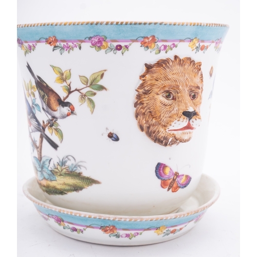 158 - A Meissen [outside decorated] cache pot and stand with lion mask handles, painted with vignettes of ... 