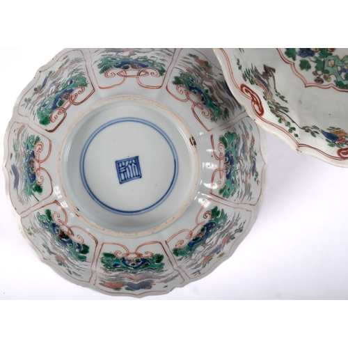 16 - A pair of Chinese famille verte bowls of moulded lobed form, enamelled with flowering branches, smal... 