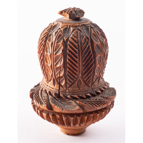 178 - A carved treen, probably coquilla nut nutmeg grater, 19th century; the domed top carved with foliage... 