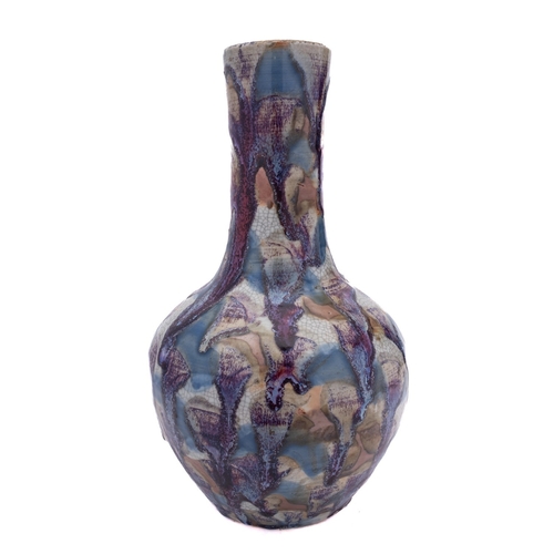 20 - A Chinese bottle vase decorated overall with splashes of blue, brown and flambé glazes on a crackled... 