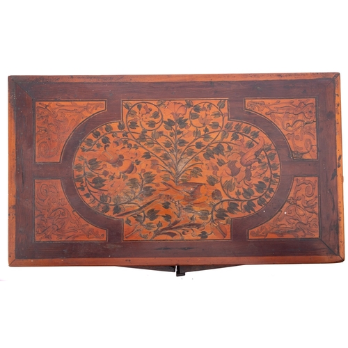 200 - A Dutch walnut and marquetry table cabinet, circa 1700;  the top with trailing foliage within a cart... 