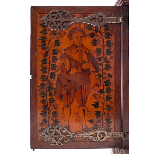 200 - A Dutch walnut and marquetry table cabinet, circa 1700;  the top with trailing foliage within a cart... 