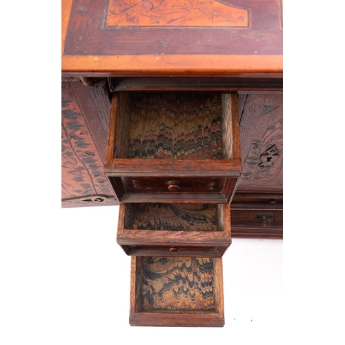 200 - A Dutch walnut and marquetry table cabinet, circa 1700;  the top with trailing foliage within a cart... 