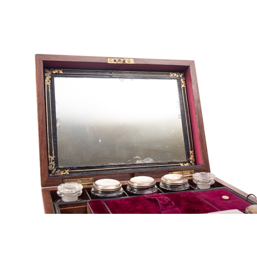 207 - A Victorian mahogany dressing case, third quarter 19th century; the hinged cover with inset monogram... 