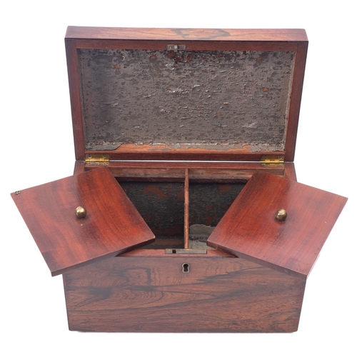 219 - A Regency rosewood tea caddy, early 19th century; of rectangular form, with a ring handle at each en... 