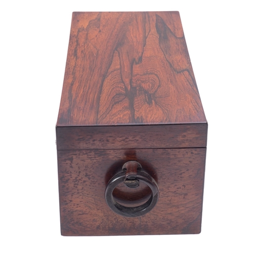 219 - A Regency rosewood tea caddy, early 19th century; of rectangular form, with a ring handle at each en... 