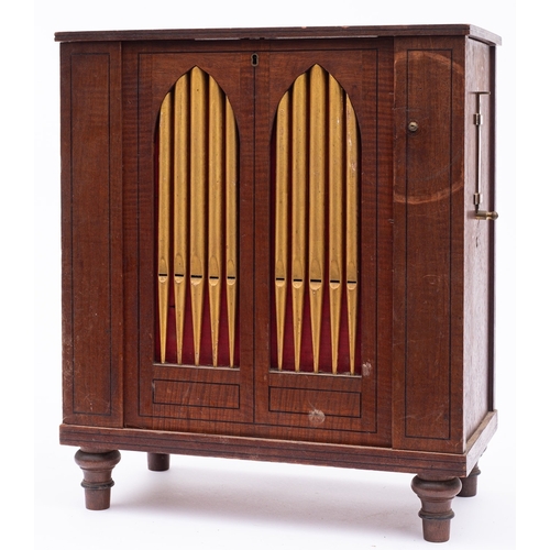 228 - A Regency mahogany table top chamber organ, early 19th century; with hinged top above the slide-up f... 