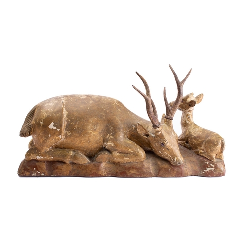 253 - A carved and giltwood group of a stag and a fawn, late 19th century; naturalistically modelled, both... 