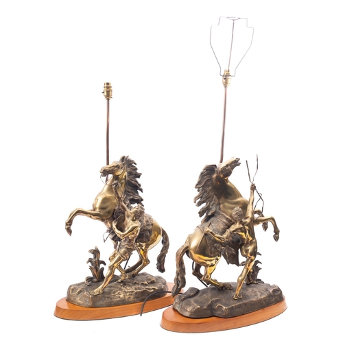 259 - A pair of Continental patinated bronze models of the Marly Horses, late 19th century and later fitte... 