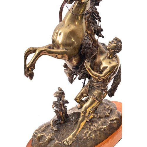 259 - A pair of Continental patinated bronze models of the Marly Horses, late 19th century and later fitte... 