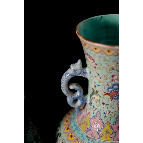 26 - A pair of Chinese famille rose baluster vases with dragon handles, painted with lotus, peony, other ... 