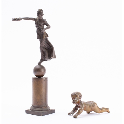 261 - A Grand Tour souvenir patinated metal model of a Nike, late 19th century; portrayed alighting on a s... 