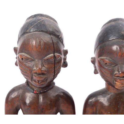 275 - A pair of West African carved and partially ebonised models of twin boys, 'Ibeji', Yoruba people, Ni... 