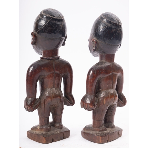 275 - A pair of West African carved and partially ebonised models of twin boys, 'Ibeji', Yoruba people, Ni... 