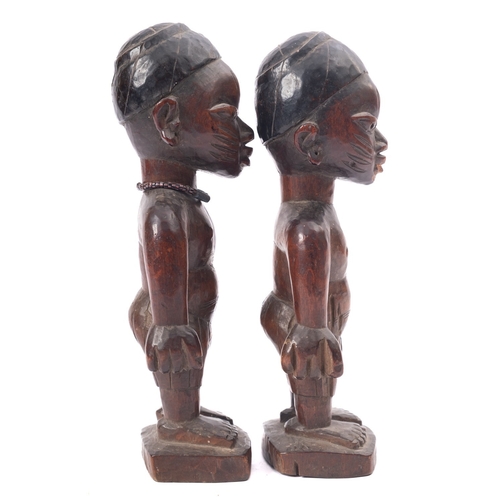 275 - A pair of West African carved and partially ebonised models of twin boys, 'Ibeji', Yoruba people, Ni... 