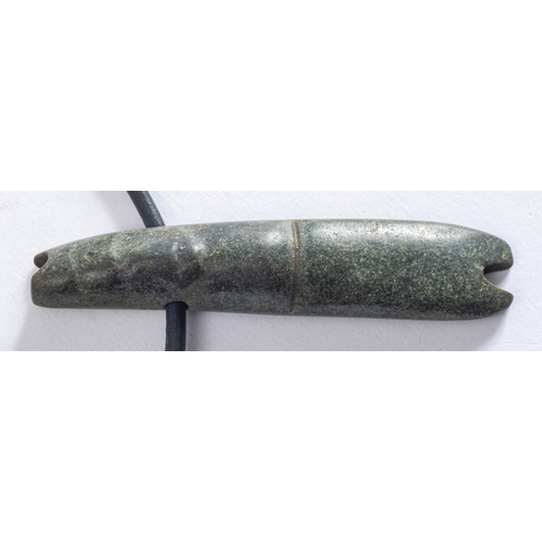 279 - A Pre-Columbian, Costa Rica, green/ grey tube pendant, on a modern leather thong, 7.2cm long  Found ... 