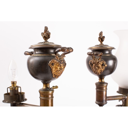 297 - A pair of George IV or William IV patinated and parcel gilt bronze table oil lamps, circa 1830; each... 