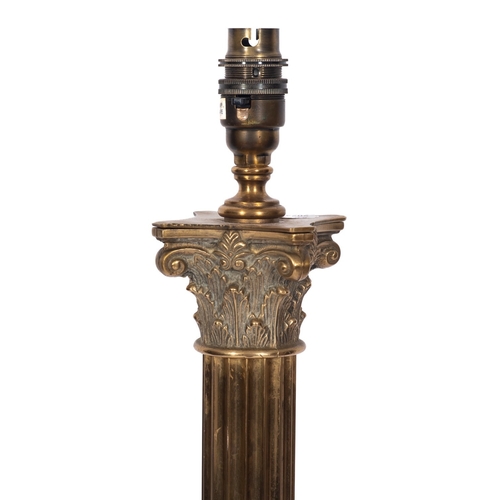 301 - A brass standard lamp in Neoclassical style, 20th century; the electrical fitment on a Corinthian ca... 