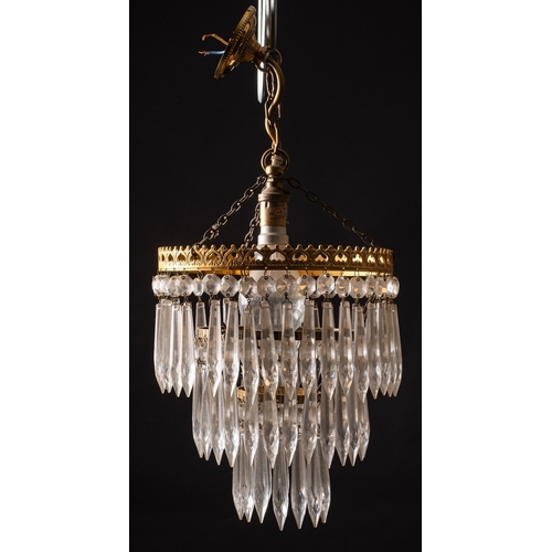 311 - A group of four faceted pendant glass hung metal ceiling lights, 20th century; comprising one with f... 