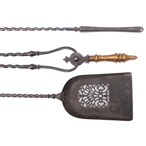 317 - A set of three steel and brass mounted fire tools in 18th century style, early 20th century; compris... 