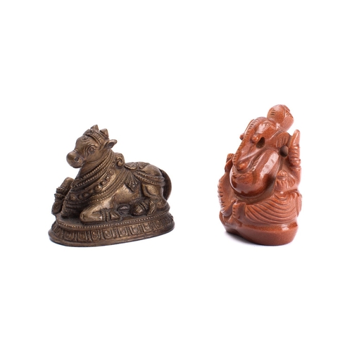 327 - An Indian carved 'goldstone' model of Ganesh and an Indian bronze figure of a Nandi Bull, 20th Centu... 